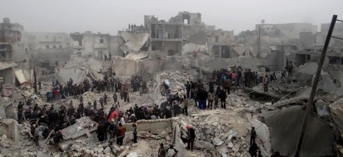 A handout picture released by Syria's opposition-run Aleppo Media Centre (AMC) shows Syrians inspecting destruction following an apparent surface-to-surface missile strike on the northern Syrian city of Aleppo on February 19, 2013. Six children were among at least 19 people killed in an apparent surface-to-surface missile strike on the northern Syrian city of Aleppo late on February 18, the Syrian Observatory for Human Rights said. AFP PHOTO/HO/ALEPPO MEDIA CENTRE == RESTRICTED TO EDITORIAL USE - MANDATORY CREDIT "AFP PHOTO / HO / ALEPPO MEDIA CENTRE" - NO MARKETING NO ADVERTISING CAMPAIGNS - DISTRIBUTED AS A SERVICE TO CLIENTS - AFP IS USING PICTURES FROM ALTERNATIVE SOURCES AS IT WAS NOT AUTHORISED TO COVER THIS EVENT, THEREFORE IT IS NOT RESPONSIBLE FOR ANY DIGITAL ALTERATIONS TO THE PICTURE'S EDITORIAL CONTENT, DATE AND LOCATION WHICH CANNOT BE INDEPENDENTLY VERIFIED ==